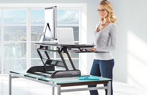 photo of woman standing desk at work
